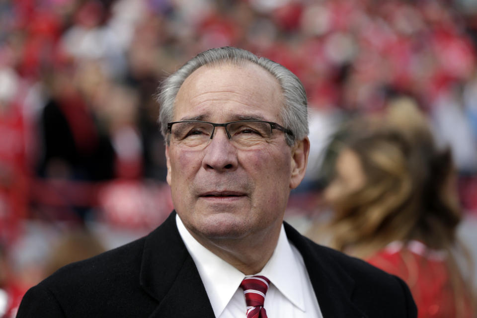 FILE- In this Nov. 4, 2017 file photo, Nebraska Athletic Director Bill Moos is seen at Memorial Stadium in Lincoln, Neb., before an NCAA college football game. Faced with the possibility college football games will be played in stadiums with reduced capacities as a safeguard against coronavirus, athletic administrators at schools with high ticket demand are making plans to determine who gets a seat. This is a particularly painful task for athletic director Bill Moos of Nebraska, which has sold out every home football game since 1962. The Cornhuskers are a year-round passion in his state. The season ticket renewal rate for the 2020 season is a robust 93 percent. (AP Photo/Nati Harnik, file)