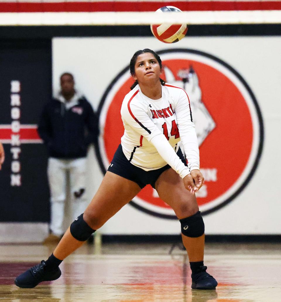 Brockton's Milani Depina sets the volleyball during a game versus Quincy on Wednesday, Sept. 7, 2022. 