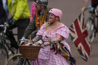 FILE - People with bicycles take part in a parade during the Platinum Jubilee Pageant outside Buckingham Palace in London, Sunday, June 5, 2022, on the last of four days of celebrations to mark the Platinum Jubilee. In the COVID era, Paris, London and Brussels expanded their bike networks the most among the nine European cities studied and experienced the largest cycling increases in return. (AP Photo/Frank Augstein, Pool, File)