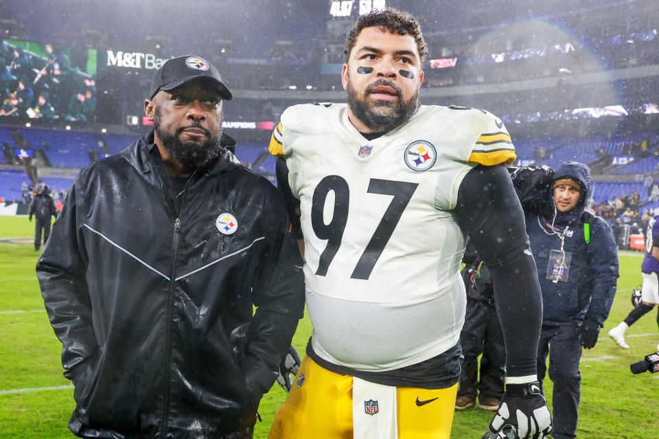 Head coach Mike Tomlin of the Pittsburgh Steelers and Cameron Heyward #97 walk off the field after the Steelers defeated the Baltimore Ravens, 17-10, at M&T Bank Stadium on January 06, 2024 in Baltimore, Maryland.
