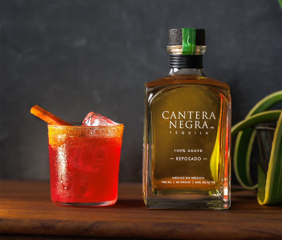 <p>Courtesy Image</p><p>This wintry take on a margarita is the perfect easy tequila cocktail to perfect this season. <a href="https://www.canteranegra.com/tequilas/cantera-negra-reposado/" rel="nofollow noopener" target="_blank" data-ylk="slk:Cantera Negra Reposado;elm:context_link;itc:0;sec:content-canvas" class="link ">Cantera Negra Reposado</a> and fresh lime and blood orange juice are complemented by a flavorful winter spice rim. </p>Ingredients<ul><li>1.5 oz Cantera Negra Reposado Tequila</li><li>0.5 oz fresh lime juice</li><li>0.5 oz fresh blood orange juice</li><li>0.5 oz agave syrup</li><li>0.75 tsp vanilla extract</li><li>Winter spice mix, for rim*</li></ul>Instructions<ol><li>Rim a rocks glass with winter spice mix. </li><li>Combine all ingredients, except spice mix, in a cocktail shaker with ice. Shake vigorously. </li><li>Strain into prepped rocks glass over fresh ice. </li><li>Garnish with a cinnamon stick.</li></ol>For the Winter Spice Mix*Ingredients<ul><li>.5 tsp salt</li><li>.5 tsp sugar</li><li>.25 tsp cinnamon</li><li>.25 tsp chili powder</li></ul>