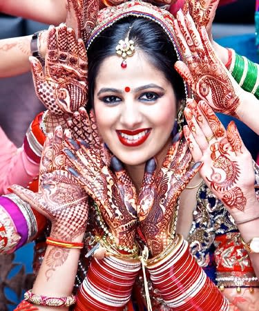 Photo of Close up shot of a South Indian bride getting ready for her  wedding day.