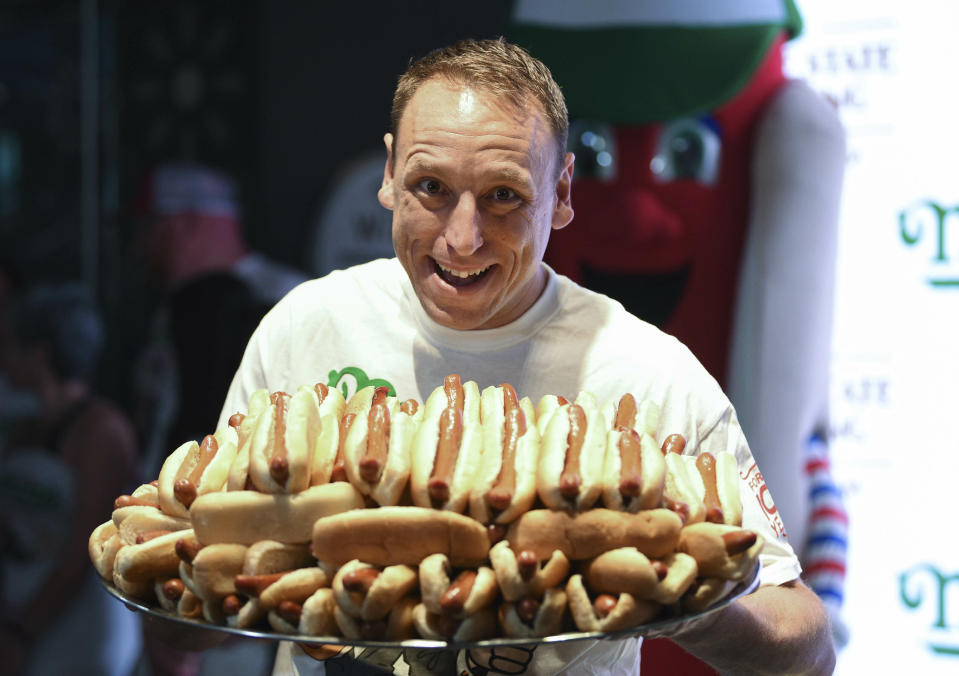 Eleven-time and defending men's champion Joey Chestnut participates in Nathan's Famous international Fourth of July hot dog eating contest weigh-in at the Empire State Building on Wednesday, July 3, 2019, in New York. (Photo by Evan Agostini/Invision/AP)