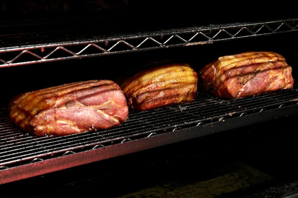 Smoked pork butt cooking in the oven Wednesday, May 12, 2021, at Smokin' Coop BBQ in Belvidere.