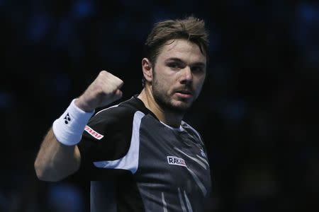 Stanislas Wawrinka of Switzerland celebrates after winning his men's singles tennis match against Tomas Berdych of the Czech Republic at the ATP World Tour Finals at the O2 Arena in London November 10, 2014. REUTERS/Stefan Wermuth