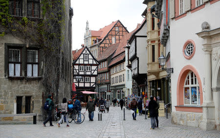 People walk on a street in the old town of Quedlinburg, Germany, May 4, 2019. Picture taken May 4, 2019. REUTERS/Fabrizio Bensch