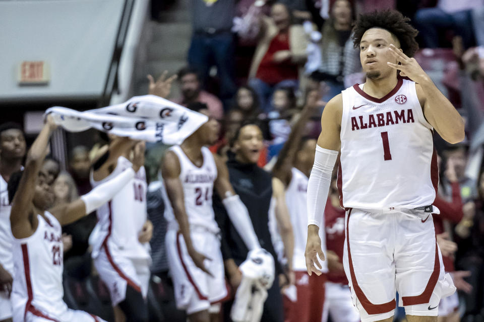 Alabama guard Mark Sears (1) celebrates with a 3-point shot against Kentucky.  (AP Photo/Vasha Hunt)