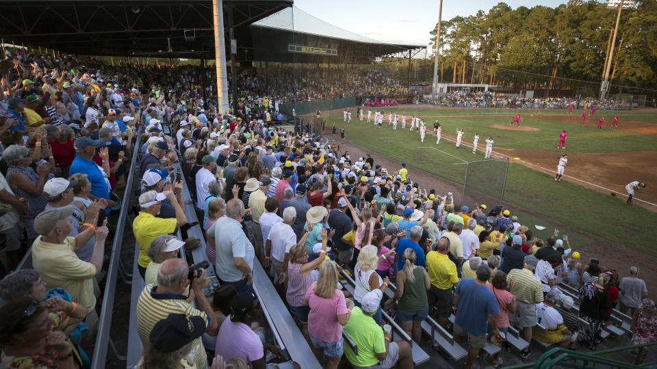 FILE - Fans pack the stands at Grayson Stadium to watch the Savannah Bananas play against the Florence Flamingos in a baseball game Tuesday, June 7, 2022, in Savannah, Ga. Grayson Stadium holds 4,000 fans for home games. The Savannah Bananas, who became a national sensation with their irreverent style of baseball, are leaving the Coastal Plains League to focus full attention on their professional barnstorming team. Owner Jesse Cole made the announcement in a YouTube video, saying “we'll be able to bring the Savannah Bananas to more people in Savannah and around the world." (AP Photo/Stephen B. Morton)