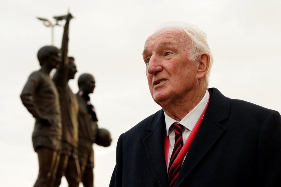 Former Manchester UNited player Alex Stepney visits the tributes in memory of Sir Bobby Charlton (PA)