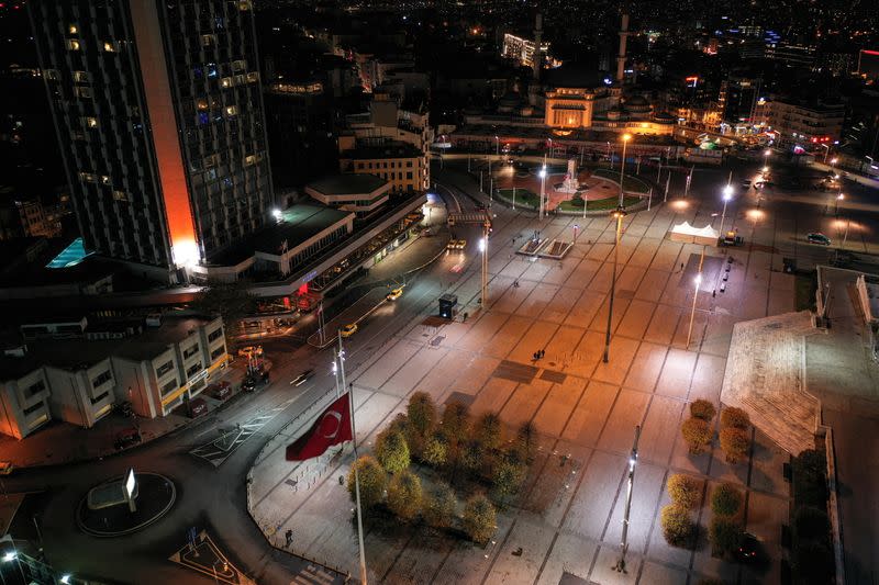 Deserted Taksim Square is seen at the popular touristic neighborhood of Beyoglu during a nation-wide weekday curfew in Istanbul