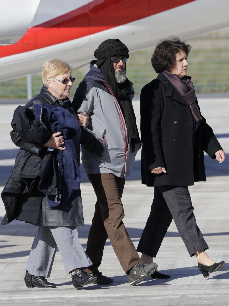 Freed French hostages arrive home