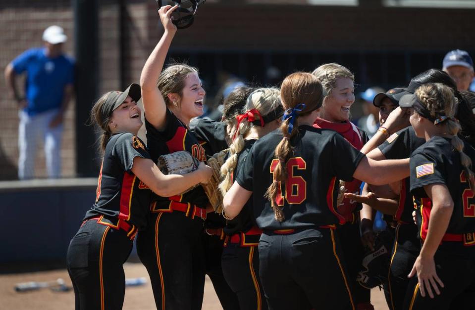 Oakdale pitcher Raegen Everett, second left, and her teammates celebrate winning the Sac-Joaquin Section D III softball championship at Cosumnes River College in Sacramento, Calif., Saturday, May 25, 2024. Oakdale won the game 3-2 over Capital Christian.