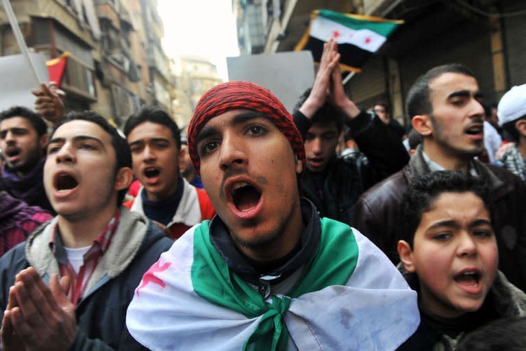 Syrians chant slogans during a demonstration after Friday prayer in the northeastern city of Aleppo on February 15, 2013