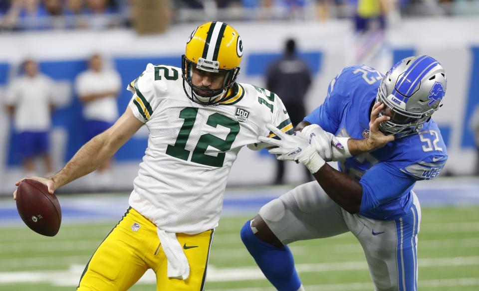 Aaron Rodgers said he had a setback to his knee when he was hit by Lions linebacker Christian Jones (52). (AP)