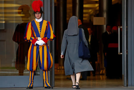 A nun enters to take part at the synod afternoon session led by Pope Francis at the Vatican October 16, 2018. Picture taken October 16, 2018. REUTERS/Max Rossi