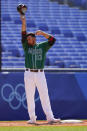 Mexico's Adrian Gonzalez wipes his face during a baseball game against Israel at Yokohama Baseball Stadium during the 2020 Summer Olympics, Sunday, Aug. 1, 2021, in Yokohama, Japan. (AP Photo/Matt Slocum)