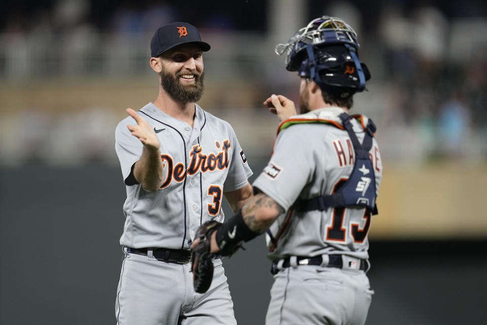 Detroit Tigers relief pitcher Chasen Shreve, left, and catcher Eric Haase celebrate after a win over the Minnesota Twins of a baseball game Friday, June 16, 2023, in Minneapolis. (AP Photo/Abbie Parr)