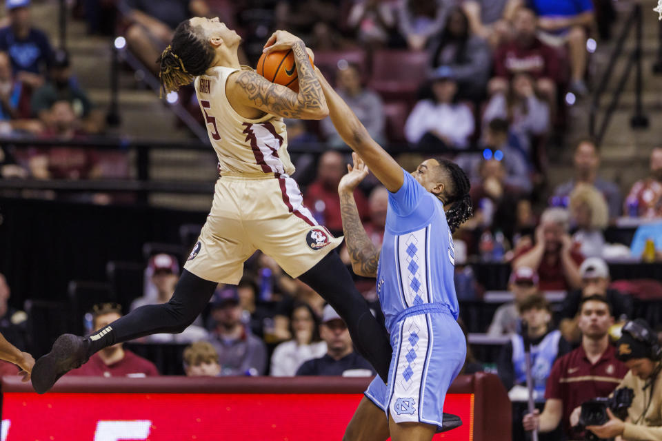 Florida State forward De'Ante Green (5) has his shot blocked by North Carolina forward Armando Bacot (5) during the second half of an NCAA college basketball game, Saturday, Jan. 27, 2024, in Tallahassee, Fla. North Carolina defeated Florida State 75-68. (AP Photo/Colin Hackley)