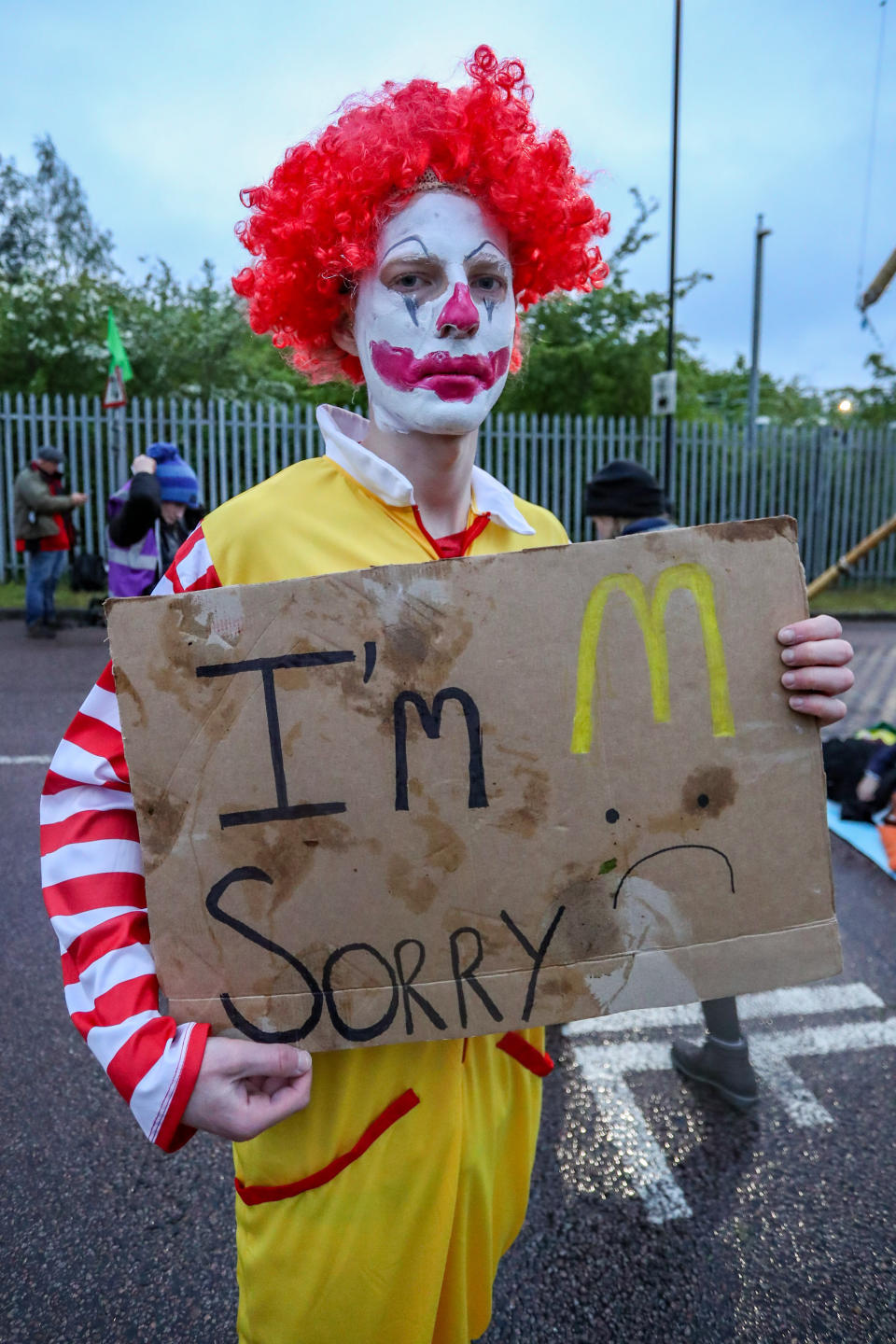 LONDON, UNITED KINGDOM - MAY 22: Protestors gather outside McDonalds distribution center in Hemel Hempstead Industrial Estate in North London on the early morning of Saturday, May 22, 2021 - to blockade the site for at least 24 hours, using trucks and bamboo structures, causing a significant disruption to the McDonald's supply chain. (Photo by Vudi Xhymshiti/Anadolu Agency via Getty Images)