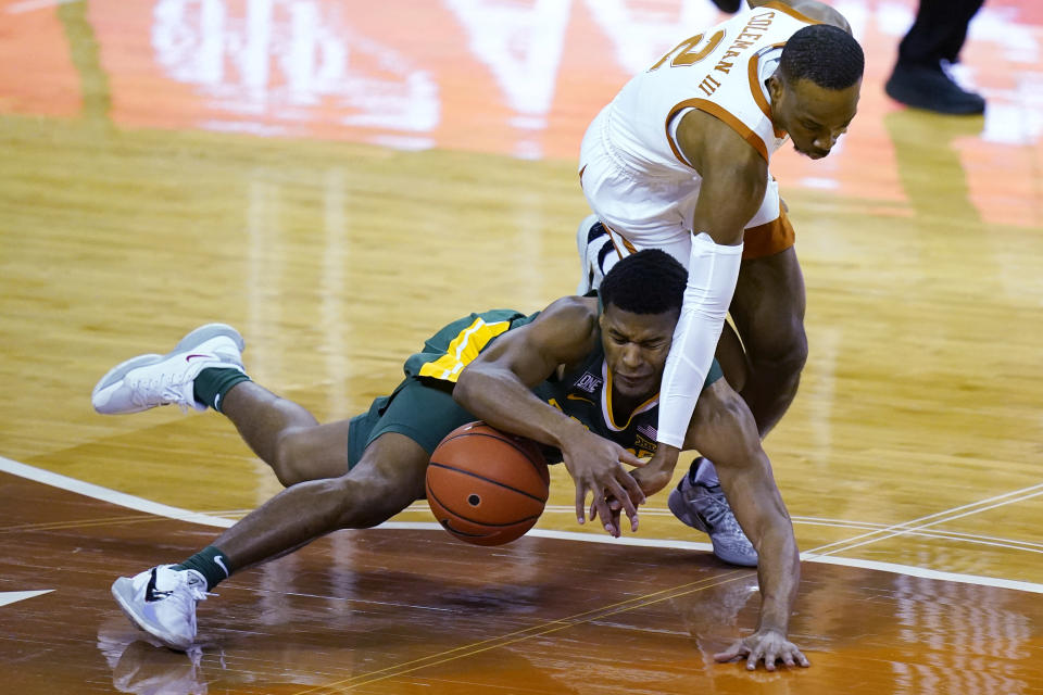Baylor guard Jared Butler, left, and Texas guard Matt Coleman III (2) vie for the ball during the first half of an NCAA college basketball game Tuesday, Feb. 2, 2021, in Austin, Texas. (AP Photo/Eric Gay)
