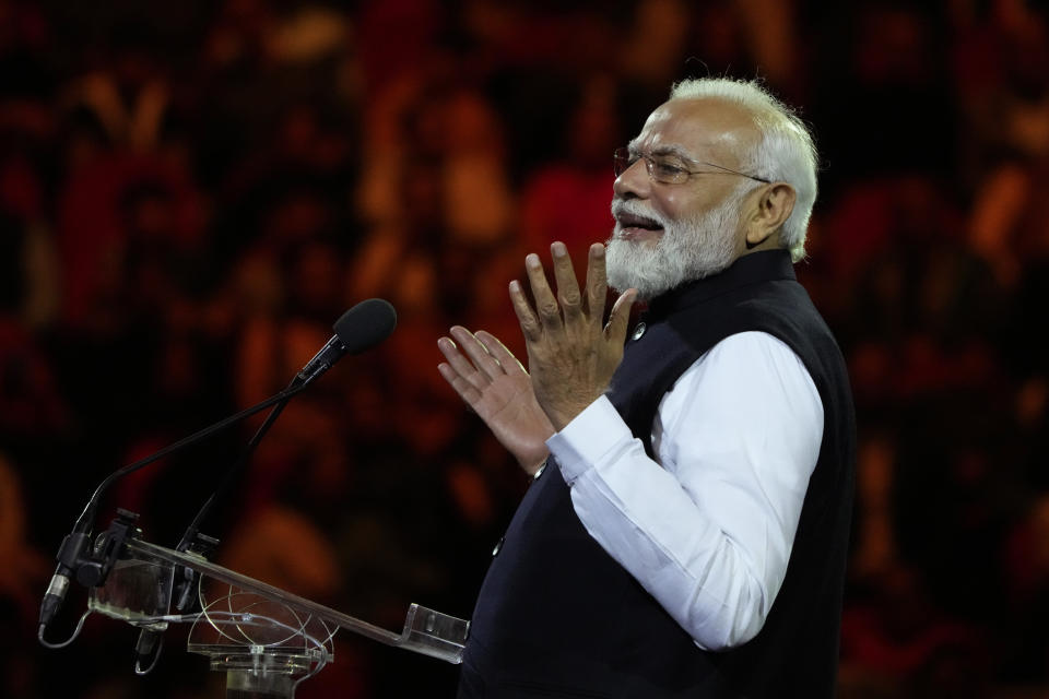 Indian Prime Minister Narendra Modi gestures as he delivers his speech during an Indian community event at Qudos Bank Arena in Sydney, Australia, Tuesday, May 23, 2023. Modi has arrived in Sydney for his second Australian visit as India's prime minister and told local media he wants closer bilateral defense and security ties as China's influence in the Indo-Pacific region grows. (AP Photo/Mark Baker)