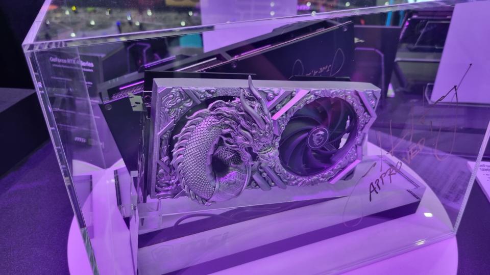 An MSI AI-designed graphics card, with a silver dragon emerging from the cooler