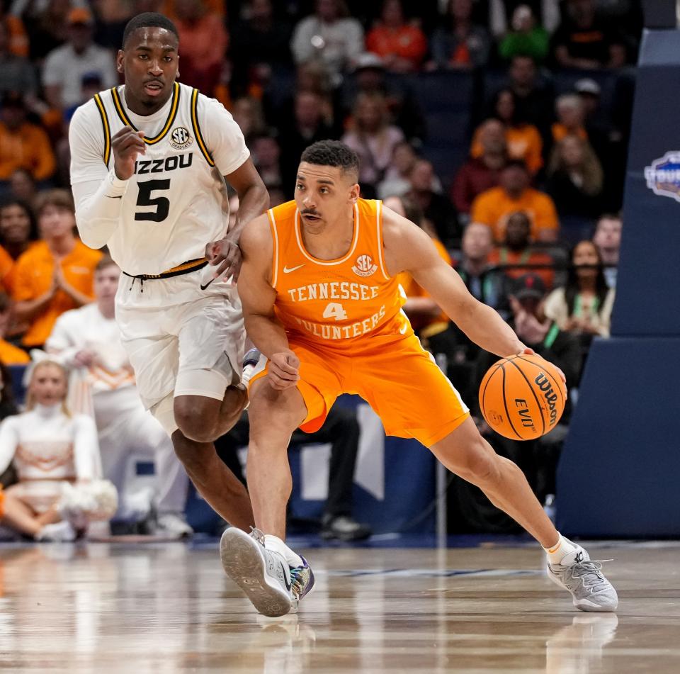 Tennessee guard Tyreke Key (4) is guarded by Missouri guard D'Moi Hodge (5) during the first half of a SEC Men’s Basketball Tournament quarterfinal game at Bridgestone Arena in Nashville, Tenn., Friday, March 10, 2023.