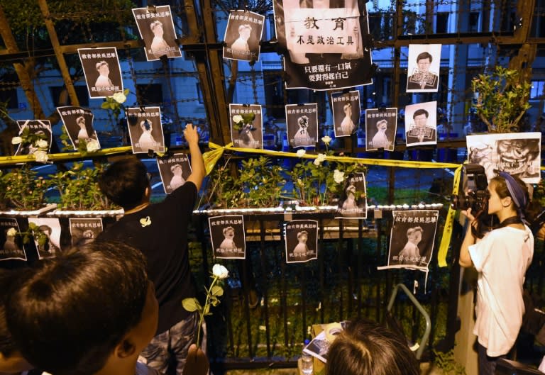 Protesters paste the portraits of Taiwan Education Minister Wu Se-hua outside the Education Ministry in Taipei during a demonstration on July 30, 2015