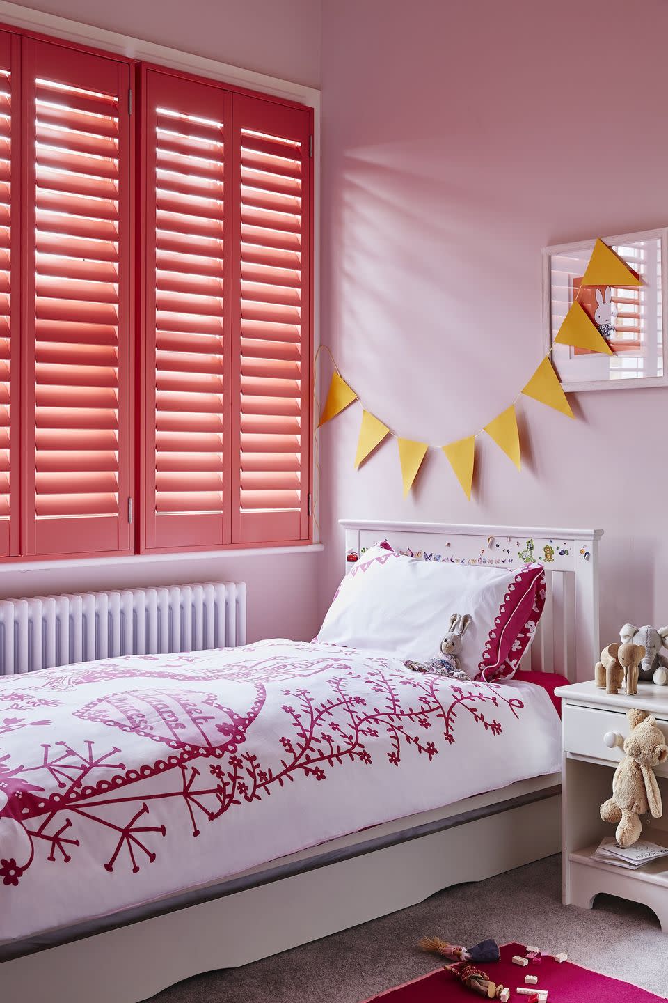 <p>Shutters are a great way to add a burst of colour to an otherwise neutral scheme, or to add a punchier look to an existing group of colours. They're great for privacy and you can adjust the amount of light that comes through. It also works well during the warmer months to add shade and keep the bedroom cool. For a girl's bedroom, use colours in similar tones as shown here to keep the room vibrant.</p><p>Pictured: Full height shutters, <a href="https://www.shutterlyfabulous.com/shutters/full-height-shutters/" rel="nofollow noopener" target="_blank" data-ylk="slk:Shutterly Fabulous;elm:context_link;itc:0;sec:content-canvas" class="link ">Shutterly Fabulous</a></p>