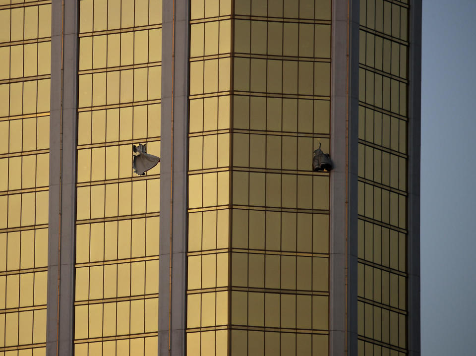 <p>Drapes billow out of broken windows at the Mandalay Bay resort and casino on the Las Vegas Strip, following a mass shooting at a music festival in Las Vegas, Nev., on Oct. 2m 2017. From two broken-out windows of the resort, Stephen Craig Paddock had an unobstructed view to rain automatic gunfire on the crowd, with few places for them to hide. Sunday nightâs bloodbath left dozens of people dead and hundreds wounded. (Photo: John Locher/AP) </p>