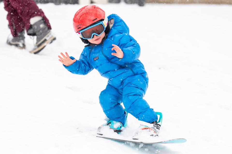 Colter Burdette (2.5), from Yardley, does a manual while snowboarding on a lawn along E. Bell Ave. as snow continues to fall in Yardley on Friday, Jan. 19, 2024.

Daniella Heminghaus | Bucks County Courier Times