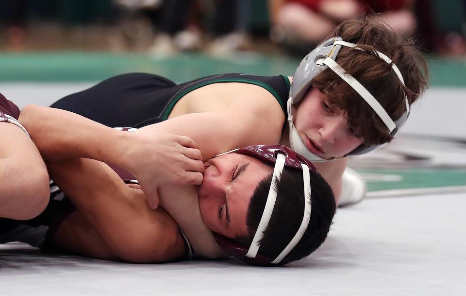 Gio Tornambe from Yorktown and Angel Ibarra from Ossining wrestle in the 108-pound weight class during the Section 1 Division I Dual Meet Tournament at Yorktown High School Dec. 21, 2023. Tornambe won the match.