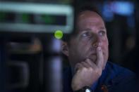 Barclay's specialist trader Glenn Carrell works at his post on the floor of the New York Stock Exchange April 15, 2014. REUTERS/Brendan McDermid