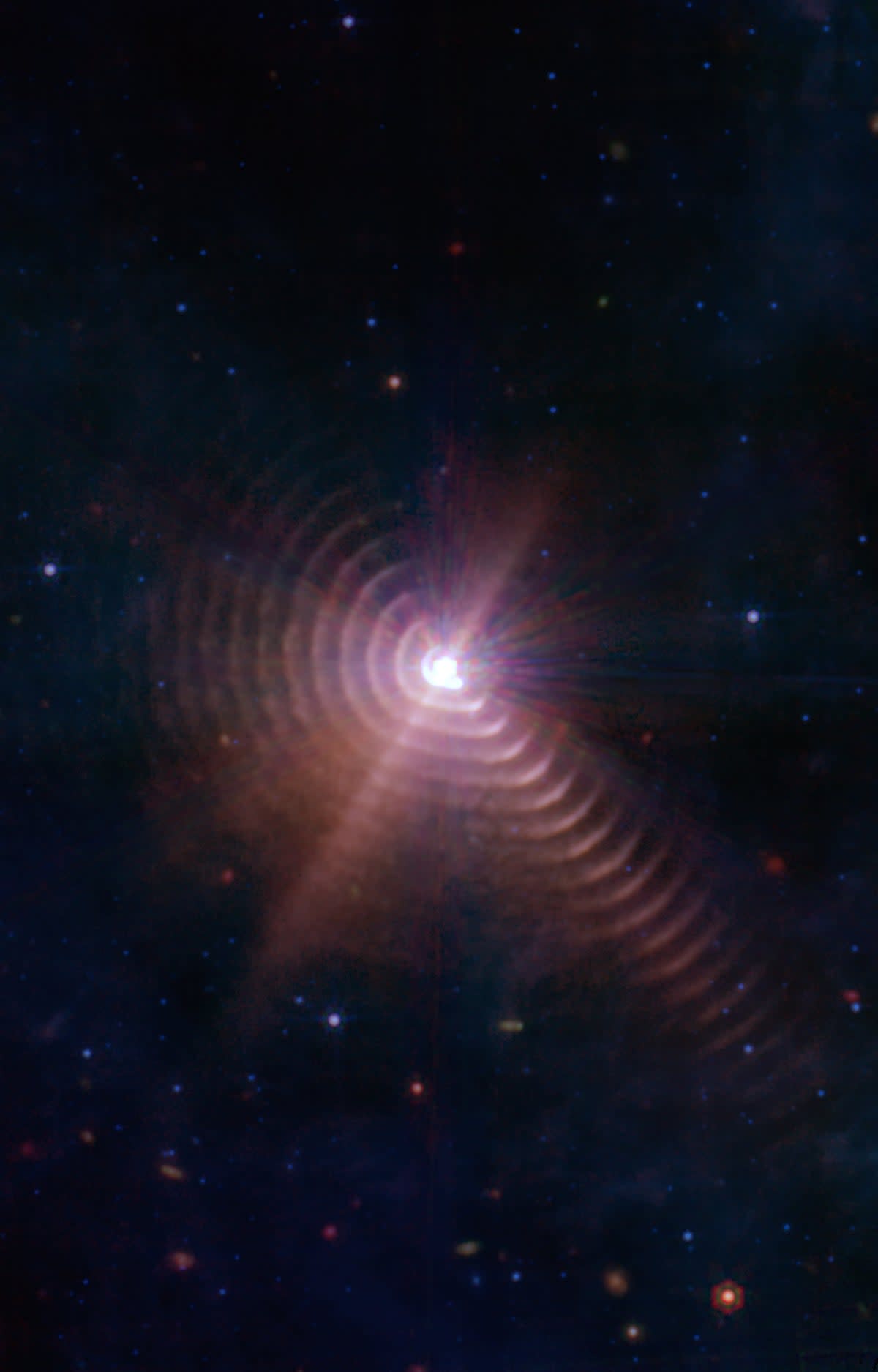 Rings of dust are blown away from the binary star WR140, pushed across the cosmos by powerful solar wind (NASA, ESA, CSA, STScI, JPL-Caltech)