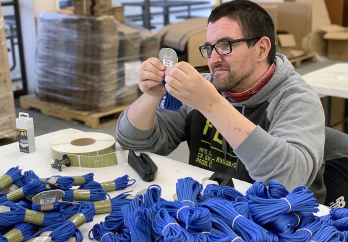 Jason Peterson works on a project for Gladding Braided Products as part of the Herkimer Industries division of Arc Herkimer. 