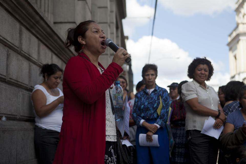 Human rights activist Iduvina Hernandez shouts slogan in support of Guatemala's Attorney General Claudia Paz y Paz during a protest in front of Congress in Guatemala City, Monday, Feb. 10, 2014. Human rights groups in Guatemala are protesting the Supreme Court's decision to oust the country's crusading attorney general seven months before her term was set to end. (AP Photo/Moises Castillo)