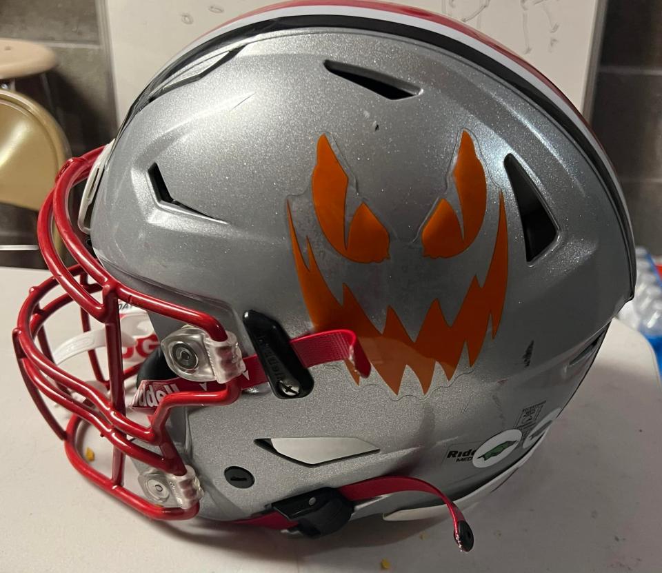 The Morton football team will sport orange jack-o-lantern stickers to celebrate the city's Pumpkin Festival, set for the weekend.