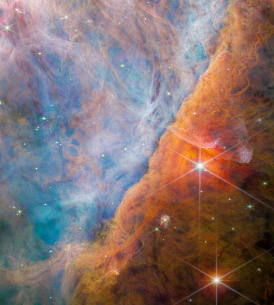 NASA's James Webb took this image of a nebula made of many layers of cloudy, colourful material.
