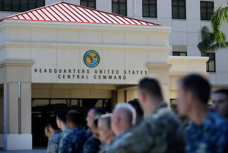 FILE PHOTO: U.S. military personnel stand outside the U.S. Central Command (CENTCOM) and Special Operations Command (SOCOM) headquarters during U.S. President Donald Trump's visit in Tampa, Florida, U.S., February 6, 2017. REUTERS/Carlos Barria/File Photo