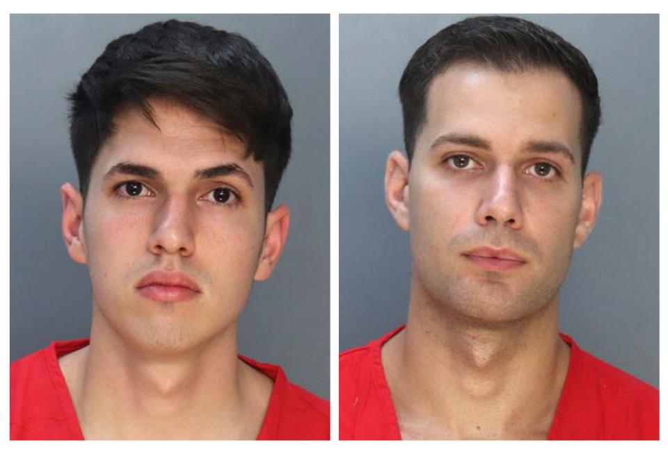 This combo of booking photos provided by the Miami-Dade County Corrections and Rehabilitation show Lorenzo Orfila, 27, left, and Rafael Otano, 22, who were booked into jail Thursday morning, Jan. 26, 2023, in Miami. The two former South Florida police officers turned themselves in to face felony charges over the beating of a homeless man who had been drinking outside a shopping center last month.