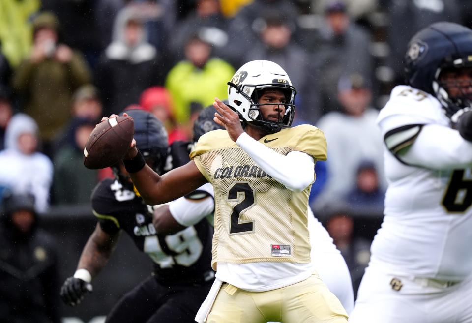 Colorado Buffaloes quarterback Shedeur Sanders (2) prepares to pass during a spring game event at Folsom Field.