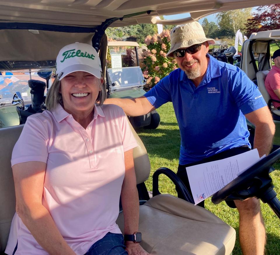 Nancy O’Reilly, left, and Bob Camp take a moment between holes at the PGA Tour's HOPE golf outing earlier this week at Kirkbrae Country Club in Rhode Island.