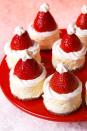 <p>We're obsessed with this dessert for two reasons: 1) They're ridiculously cute and 2) they're ridiculously simple.</p><p>Get the <a href="https://www.delish.com/uk/cooking/recipes/a29685875/santa-hat-cheesecake-bites-recipe/" rel="nofollow noopener" target="_blank" data-ylk="slk:Santa Hat Cheesecake Bites;elm:context_link;itc:0;sec:content-canvas" class="link ">Santa Hat Cheesecake Bites</a> recipe.</p>