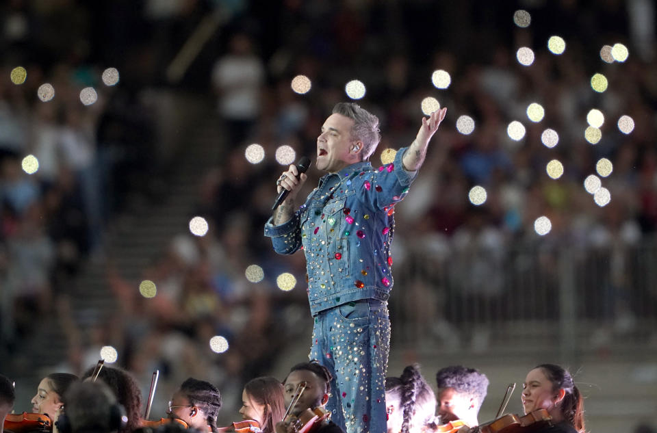 Robbie Williams performs at half-time during the Soccer Aid for UNICEF match at The London Stadium, London. Picture date: Sunday June 12, 2022.