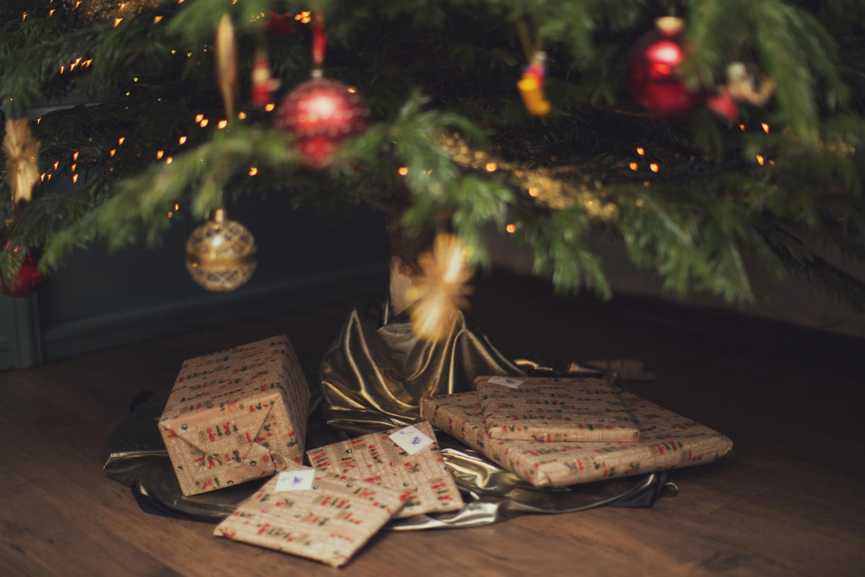 wonderfully wrapped Christmas presents under Christmas tree