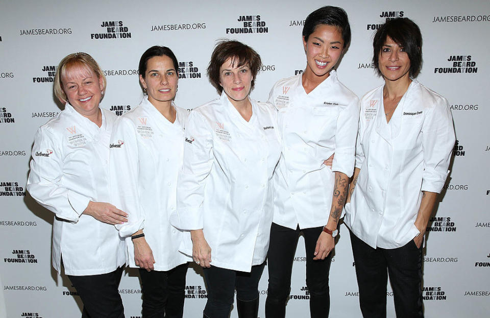 Lynch standing in the middle of a group of five female chefs