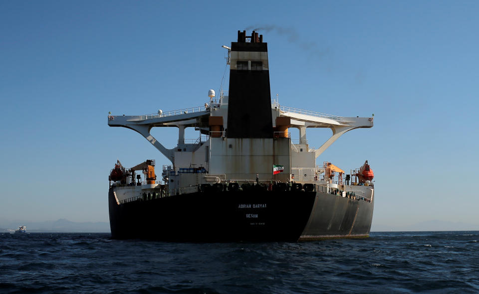 An Iranian flag flies at Iranian oil tanker Adrian Darya 1, before being named as Grace 1, as it sits anchored after the Supreme Court of the British territory lifted its detention order, in the Strait of Gibraltar, Spain, August 18, 2019. REUTERS/Jon Nazca