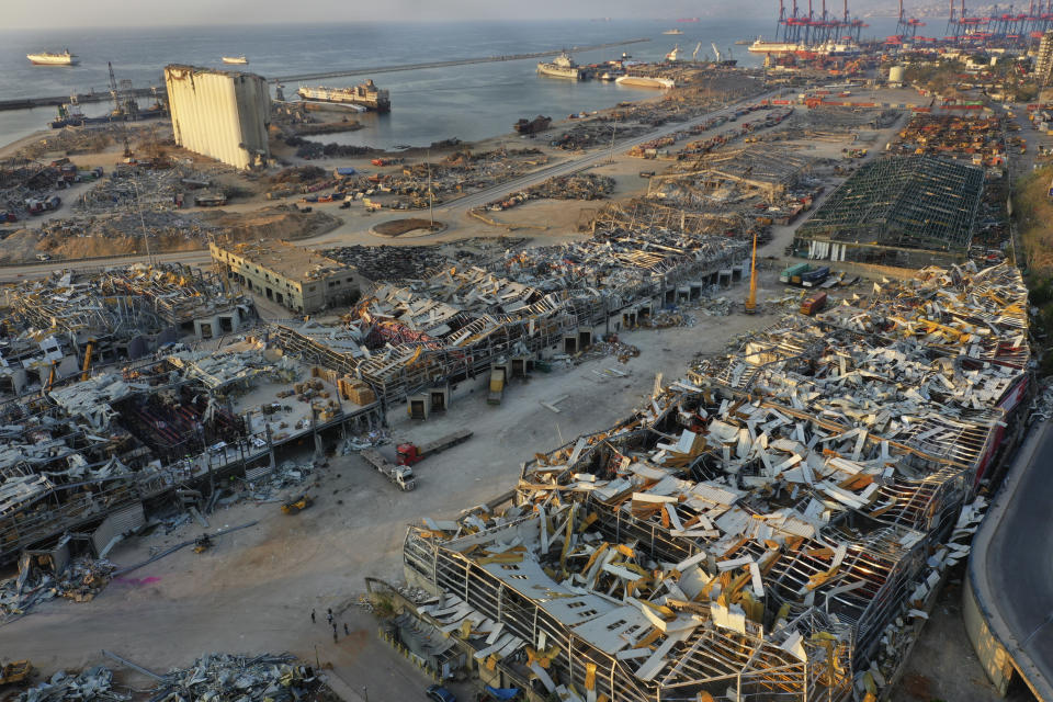 FILE - This Aug. 28, 2020 file photo, shows destroyed port warehouses at the scene of the Aug. 4 massive explosion that hit the seaport of Beirut, Lebanon. On Friday April 9, 2021, a delegation representing private German companies met Lebanese officials this week and briefed them on a multi-billion dollar study to rebuild the port of Beirut and surrounding neighborhoods that were destroyed by a massive blast last year. (AP Photo/Hussein Malla, File)