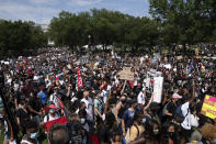 People start marching at Lincoln Memorial toward the Martin Luther King Jr. Memorial during the March on Washington, Friday Aug. 28, 2020, on the 57th anniversary of the Rev. Martin Luther King Jr.'s "I Have A Dream" speech. (AP Photo/Jose Luis Magana)