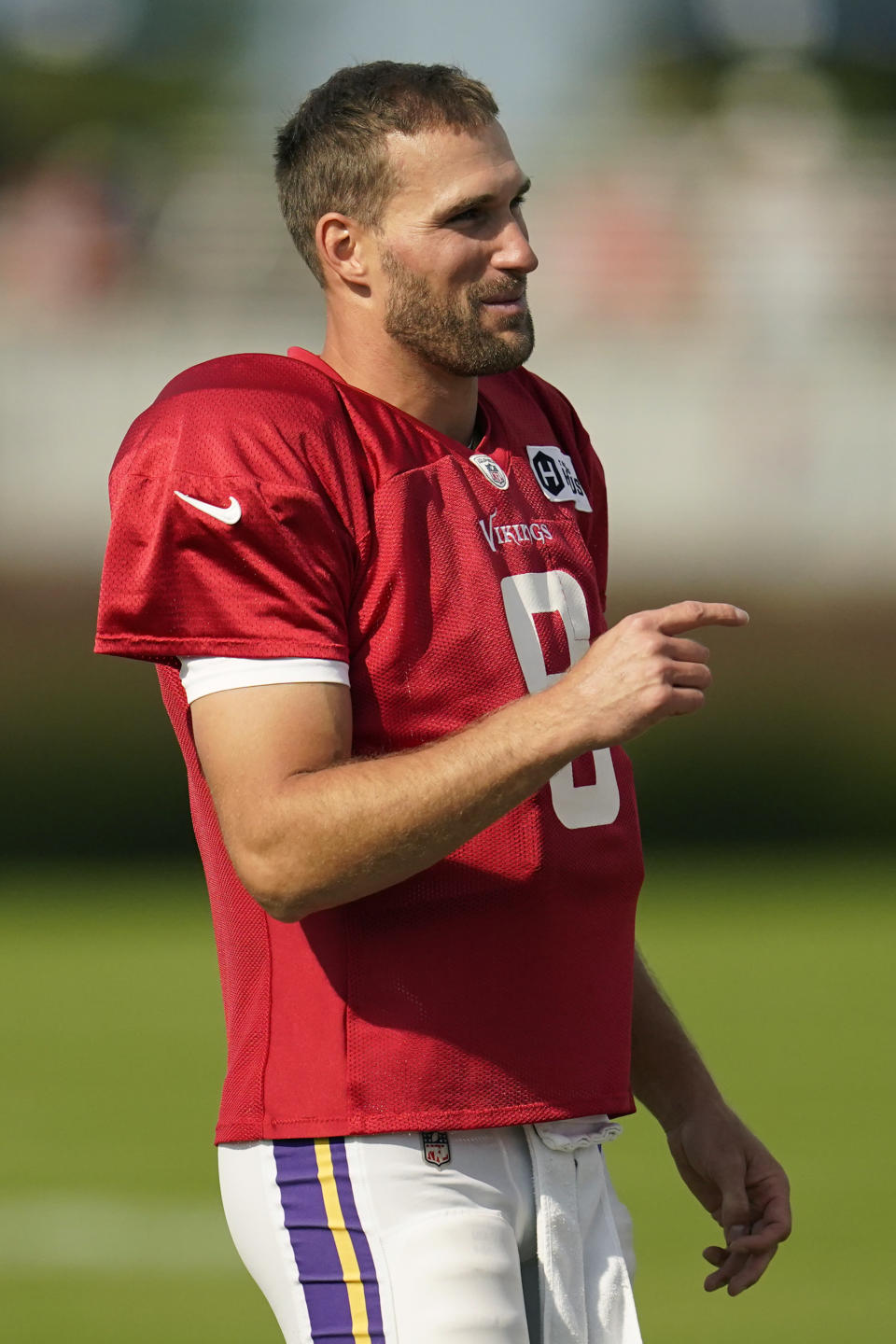 Minnesota Vikings quarterback Kirk Cousins looks on while taking part in joint drills with the San Francisco 49ers at NFL football training camp in Eagan, Minn., Thursday, Aug. 18, 2022. (AP Photo/Abbie Parr)